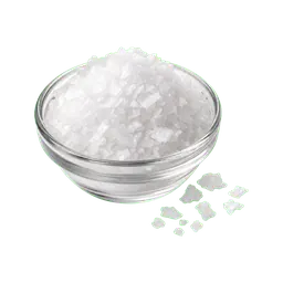 Coarse salt crystals in a small glass bowl