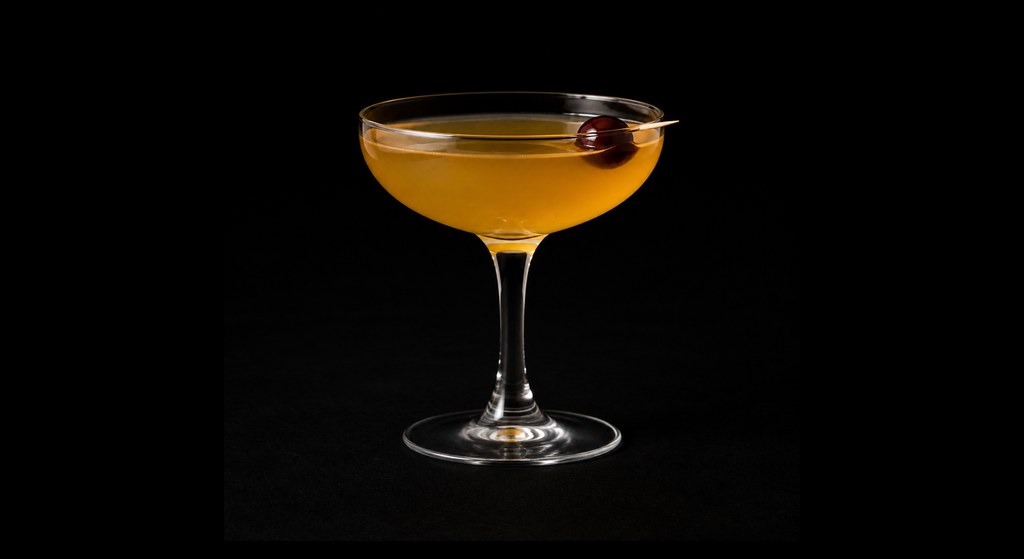 Accoutrement cocktail on a dark studio background