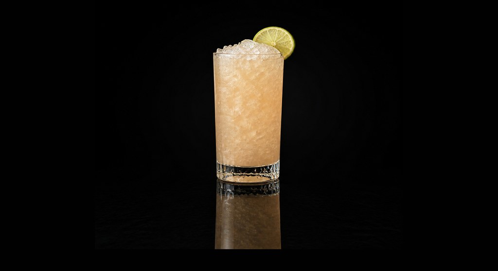 Adelaide Swizzle cocktail on a dark studio background