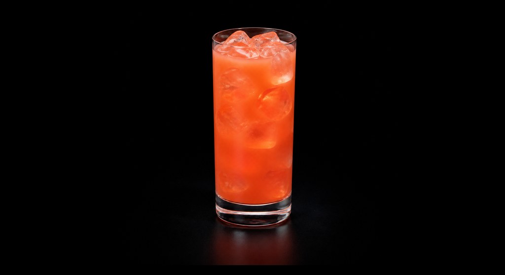 Afterglow cocktail on a dark studio background