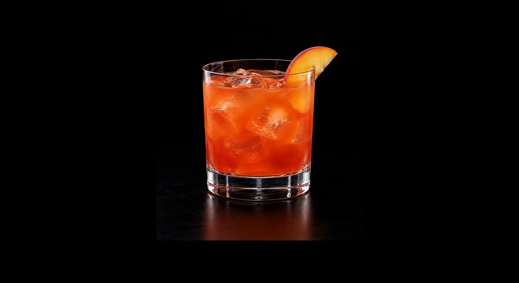 Alabama Slammer cocktail on a dark studio background