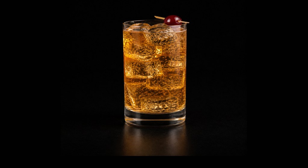 Amber Amour cocktail on a dark studio background