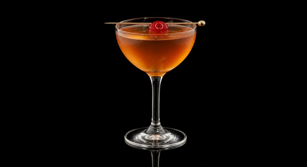 Amber Room cocktail on a dark studio background