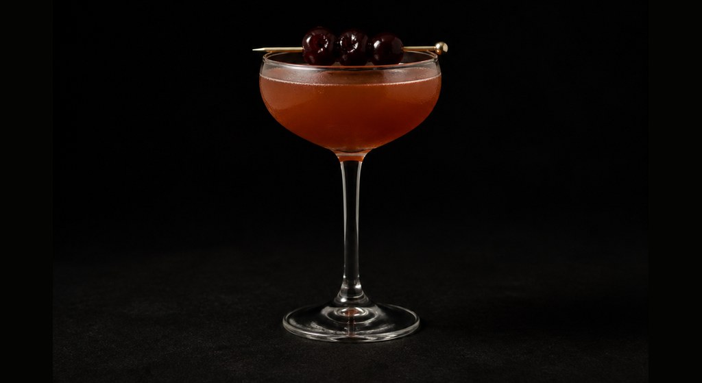 Amen Corner cocktail on a dark studio background