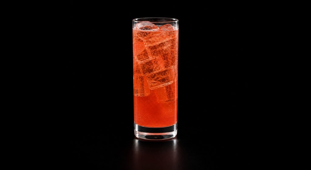 An Italian in Paris cocktail on a dark studio background