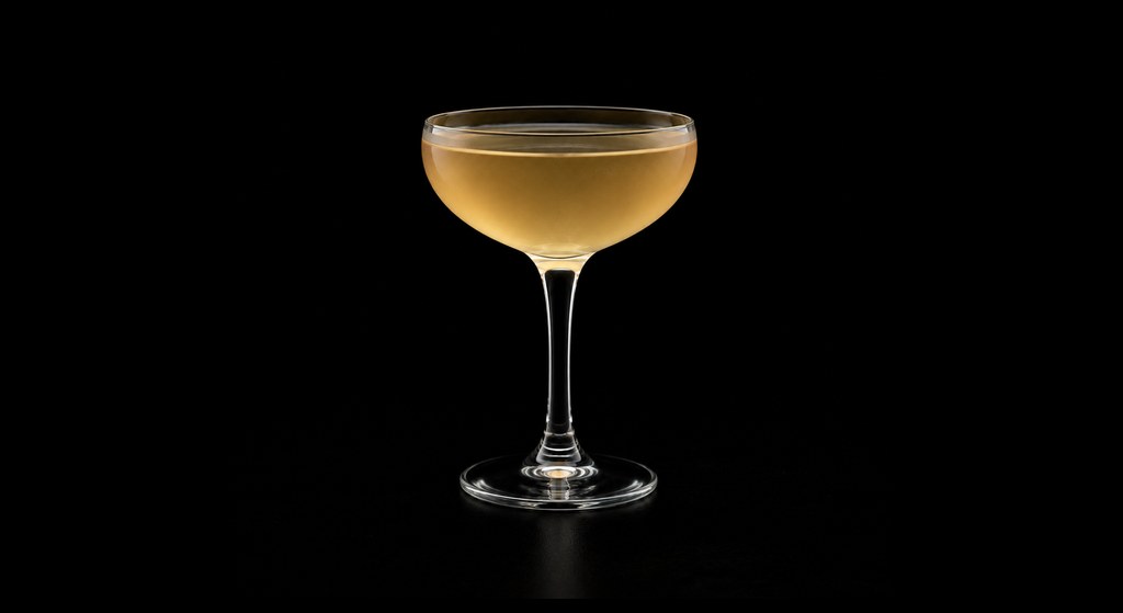 Apple Of One's Eye cocktail on a dark studio background