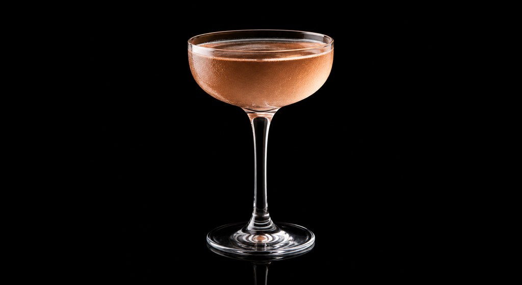 Apple Pie No. 1 cocktail on a dark studio background