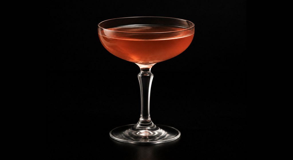Apple Pie Cocktail cocktail on a dark studio background