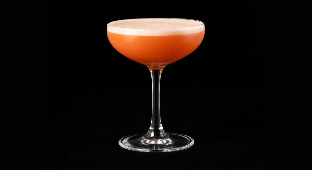 Applejack Punch cocktail on a dark studio background