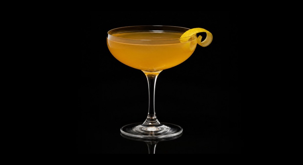 Applejack Rabbit cocktail on a dark studio background