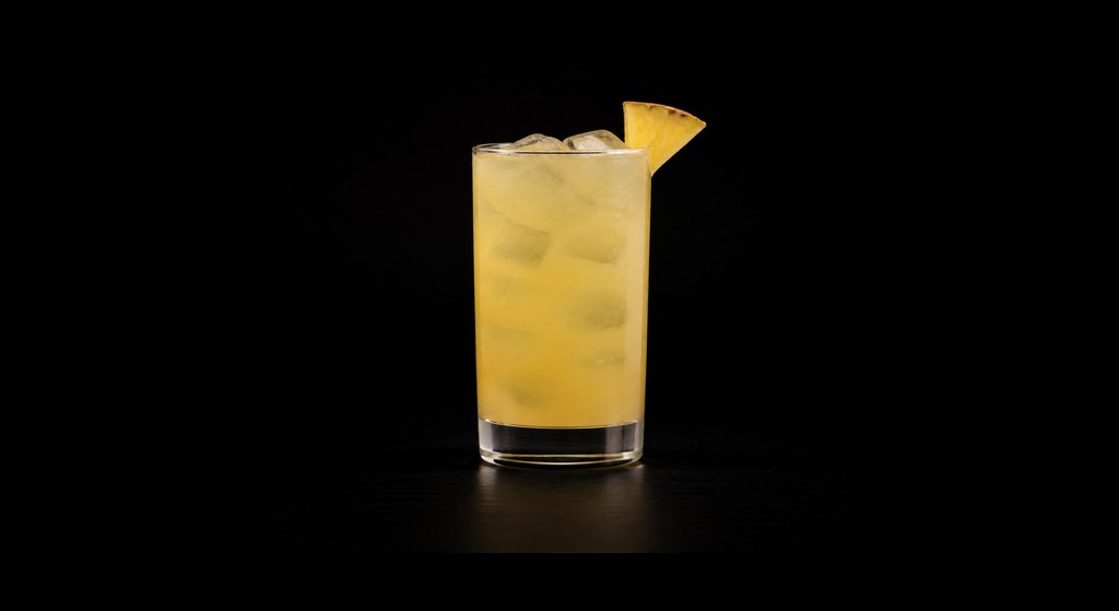 Around The World cocktail on a dark studio background