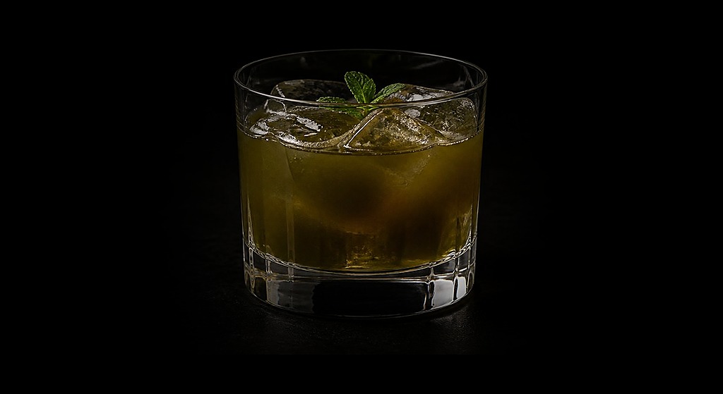 Art of Choke cocktail on a dark studio background
