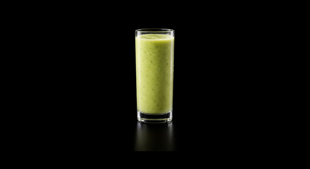Avocado Kiwi Mocktail cocktail on a dark studio background