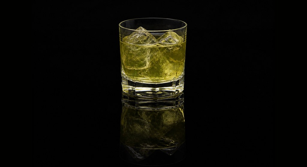 Bad Word cocktail on a dark studio background