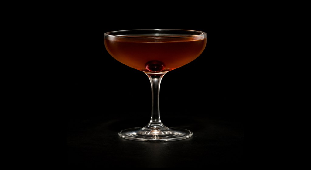 Ballroom cocktail on a dark studio background