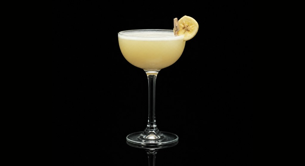 Banana Calling cocktail on a dark studio background