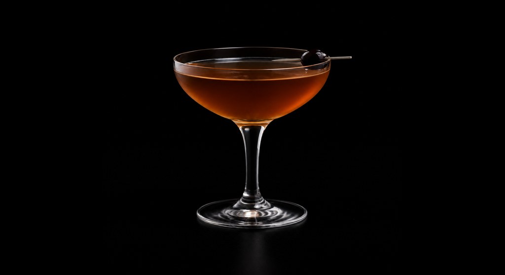 Banana Toronto cocktail on a dark studio background