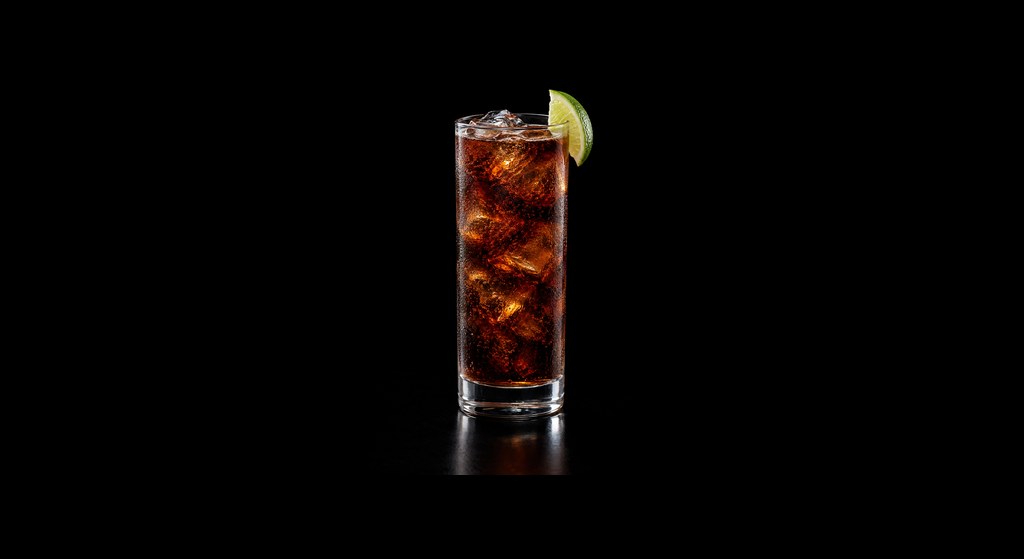 Bartender's Root Beer cocktail on a dark studio background