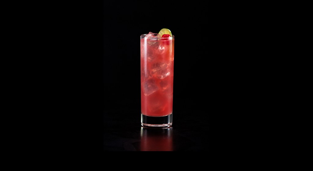 Bay of Passion cocktail on a dark studio background
