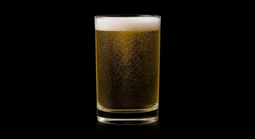 Beer Buster cocktail on a dark studio background