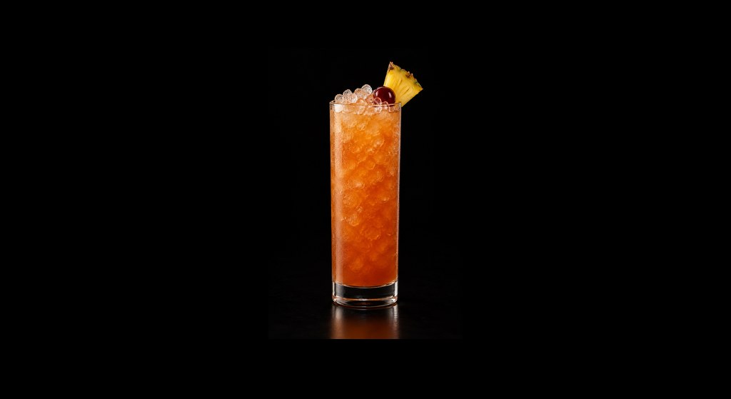 Bermuda Rum Swizzle cocktail on a dark studio background