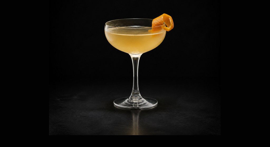 Between the Sheets cocktail on a dark studio background