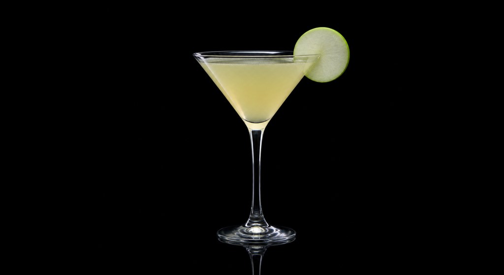 Big Apple Sour Martini cocktail on a dark studio background