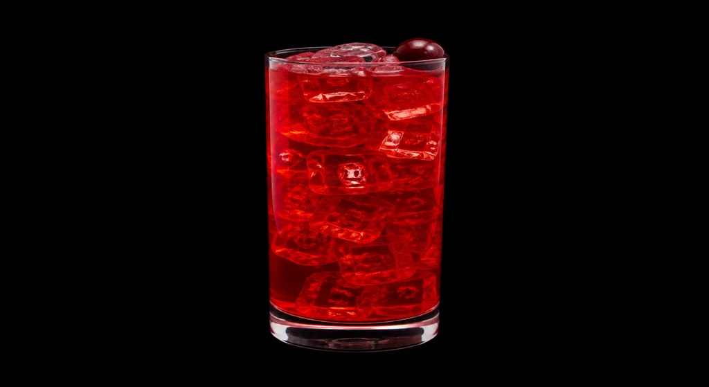 Big Red Hooter cocktail on a dark studio background