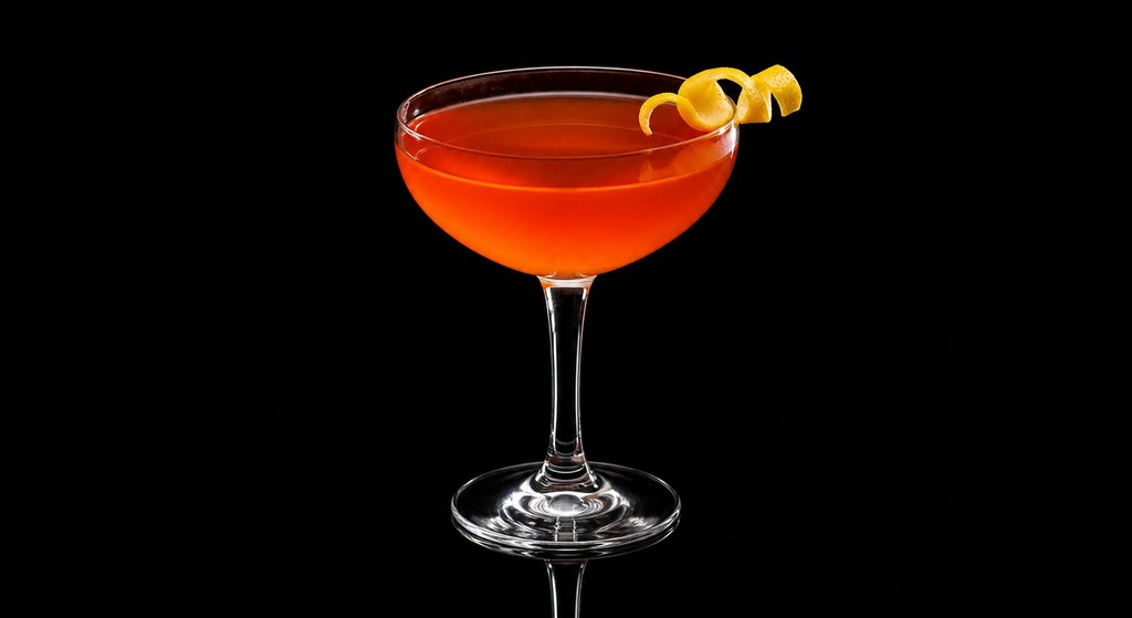 Bitter Apricot cocktail on a dark studio background
