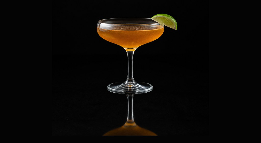 Black Daiquiri cocktail on a dark studio background