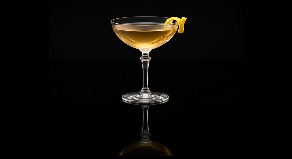 Black Feather cocktail on a dark studio background