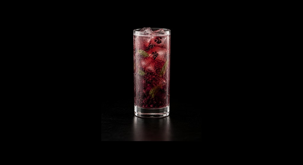 Blackberry Fizz Mocktail cocktail on a dark studio background