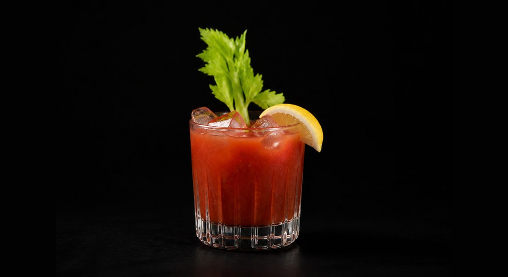 Bloody Mary cocktail on a dark studio background