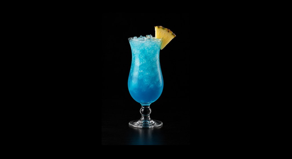 Blue Hawaii cocktail on a dark studio background