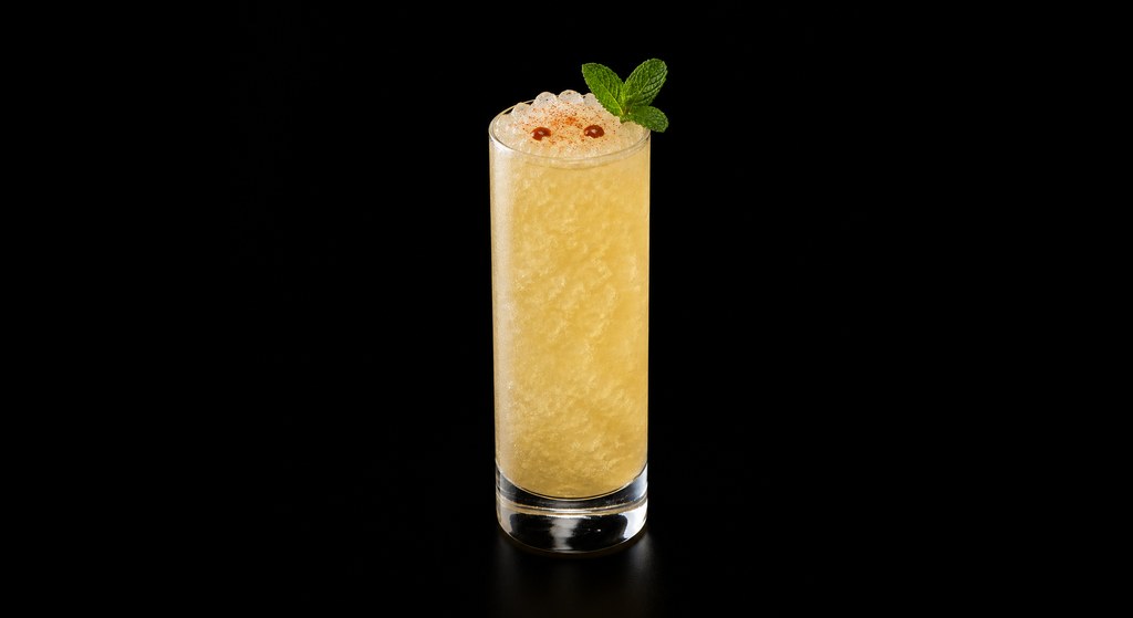 Boardwalk Flyer cocktail on a dark studio background