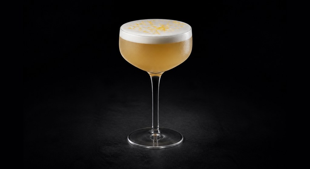 Boston Sour cocktail on a dark studio background