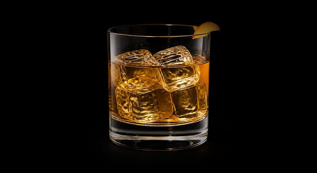 Bourbon Cobbler cocktail on a dark studio background