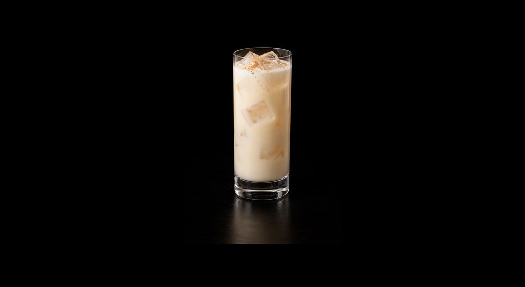 Bourbon Milk Punch cocktail on a dark studio background