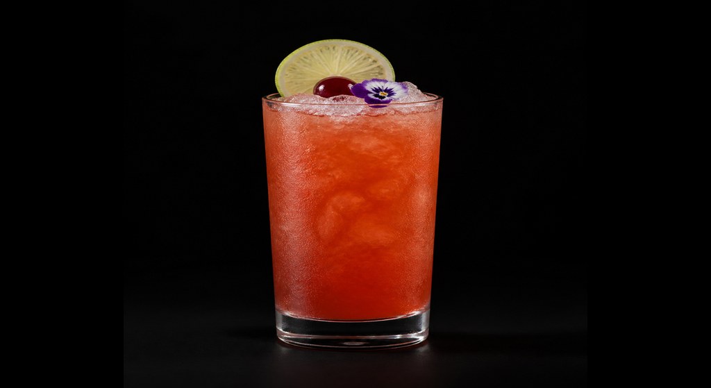 Brave Margot cocktail on a dark studio background