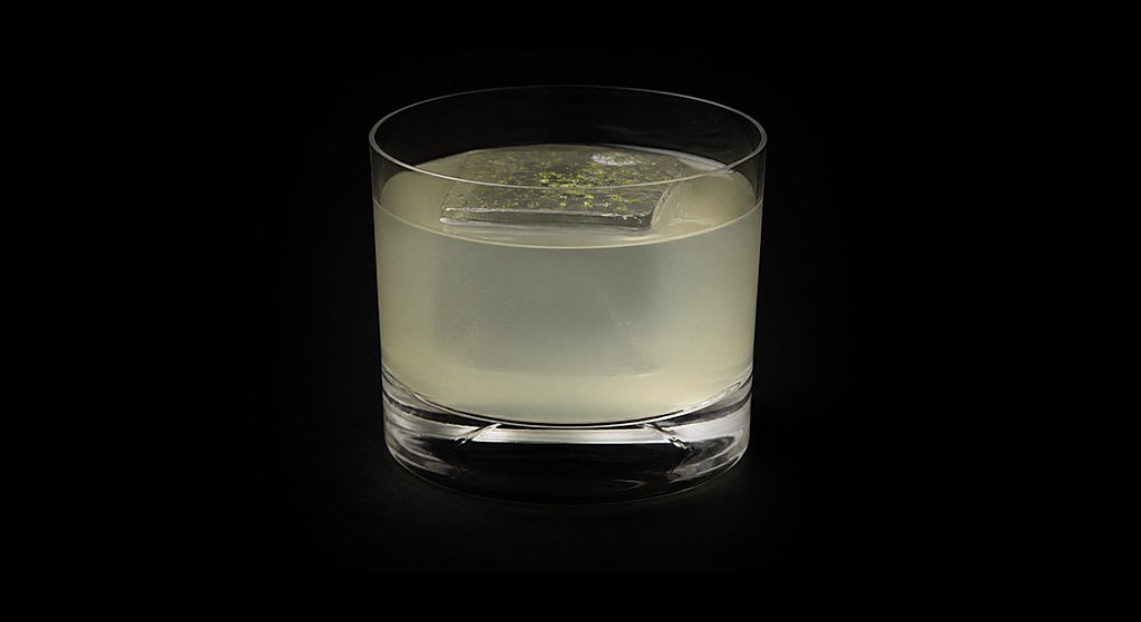 Buko Gimlet cocktail on a dark studio background