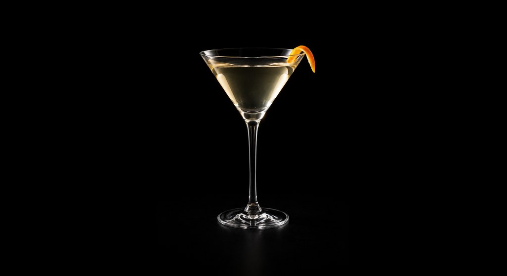 Burnt Martini cocktail on a dark studio background