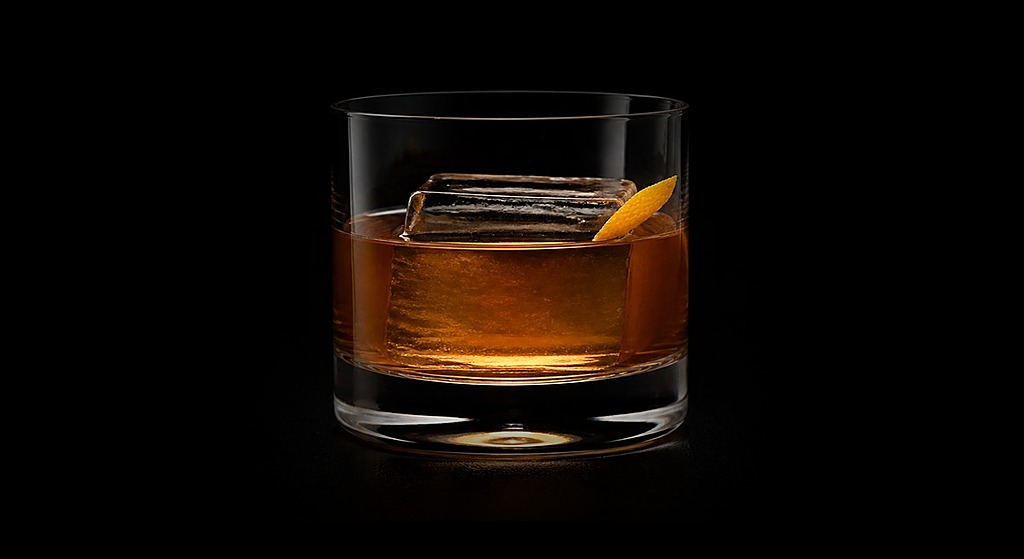 Busy Earning cocktail on a dark studio background