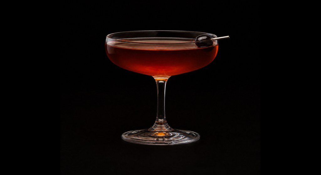Byrrh Cocktail cocktail on a dark studio background