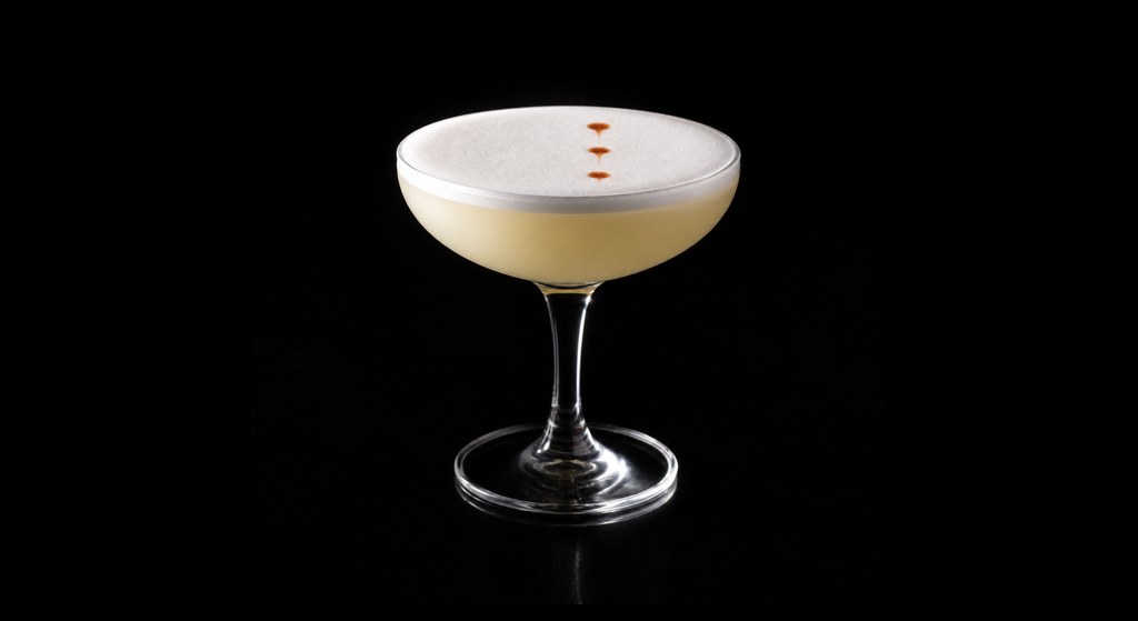 Cachaça Sour cocktail on a dark studio background