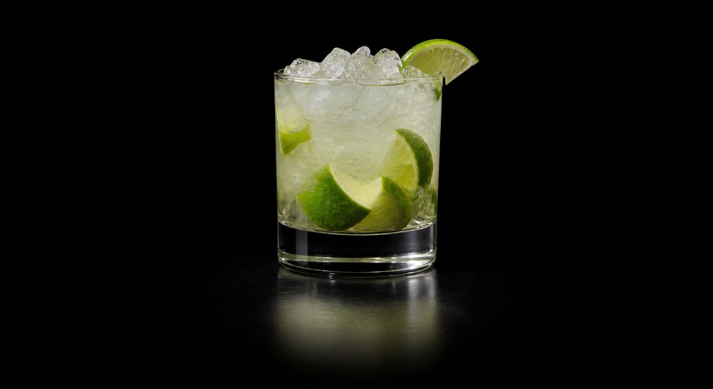 Caipirissima cocktail on a dark studio background