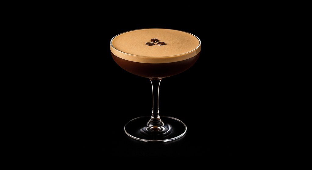 Calvados Espresso cocktail on a dark studio background