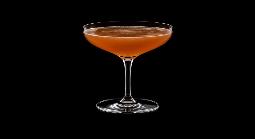 Cameron's Kick Cocktail cocktail on a dark studio background