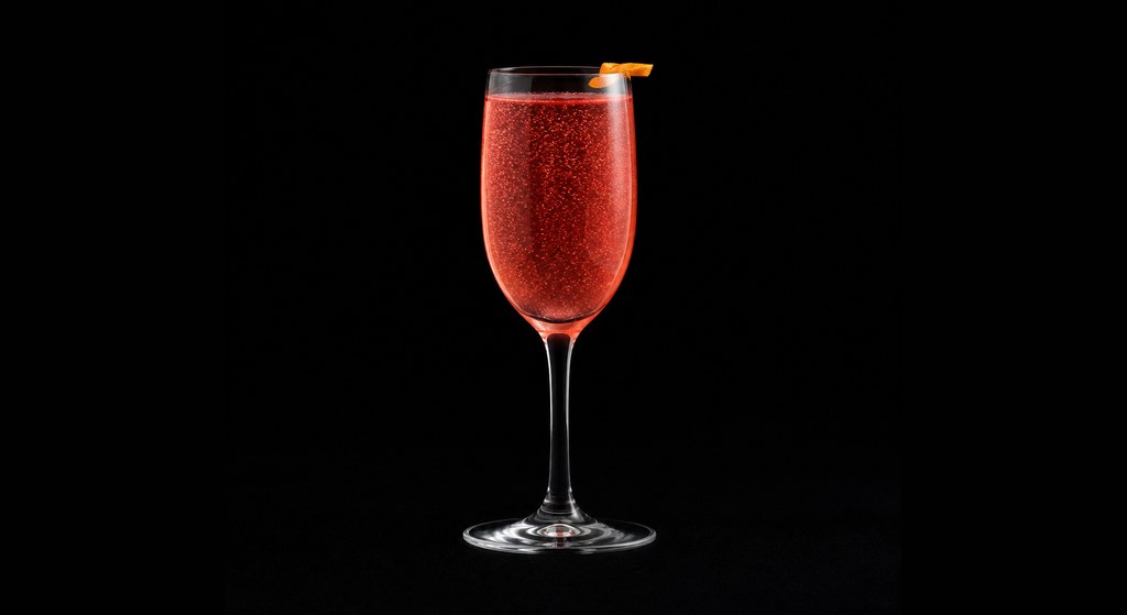 Champagne Flamingo cocktail on a dark studio background