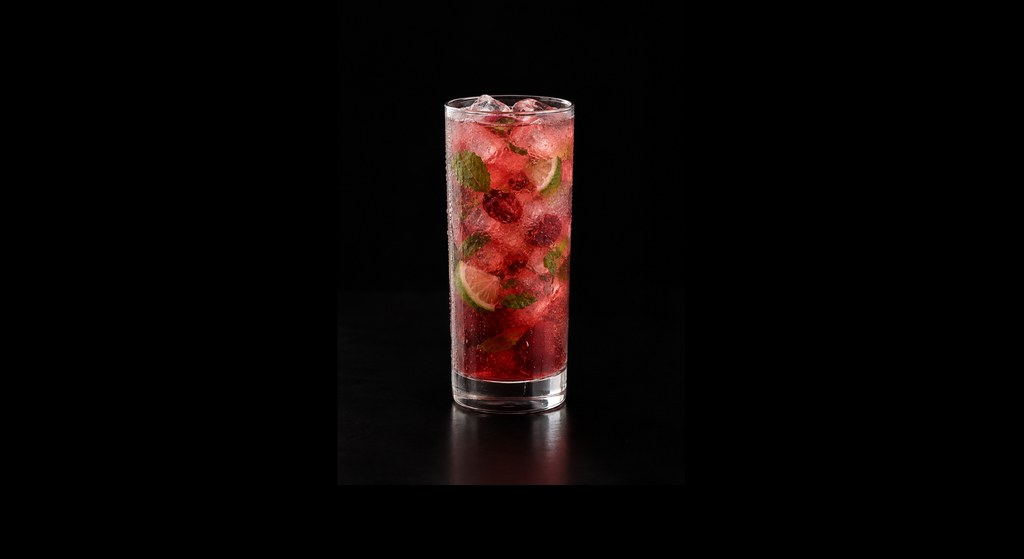 Cherry Mojito Mocktail cocktail on a dark studio background