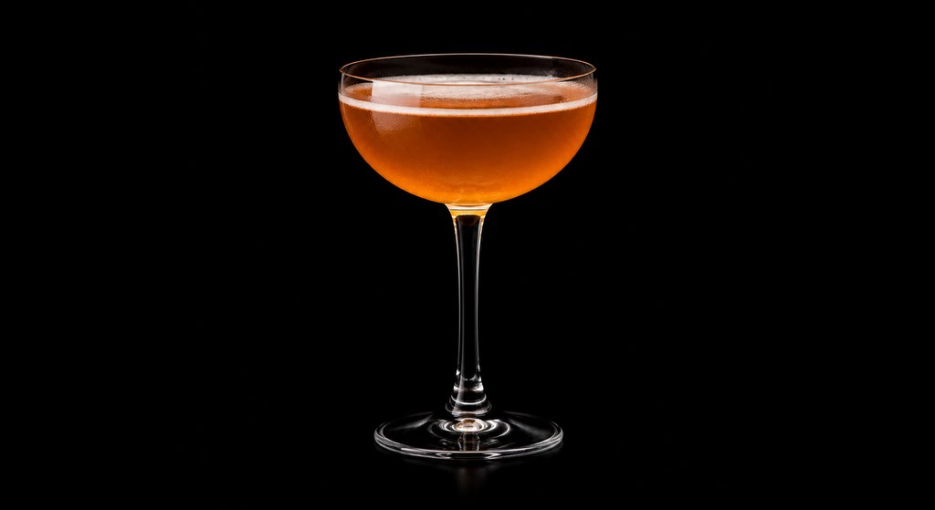 Chinchona cocktail on a dark studio background